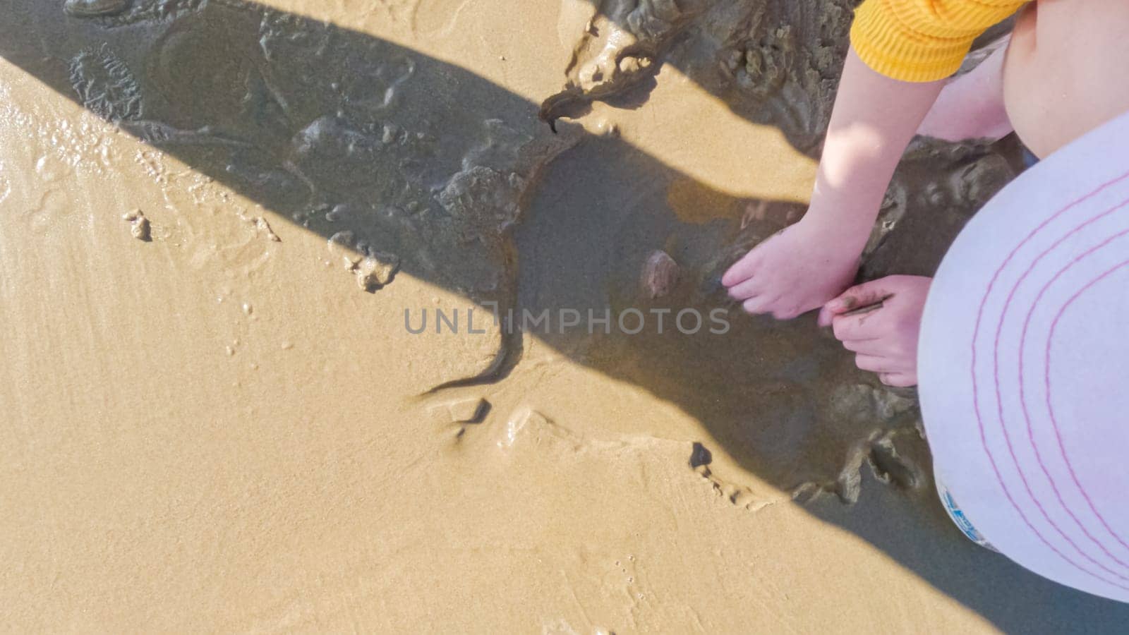 Little girl winter clamming at Pismo Beach by arinahabich