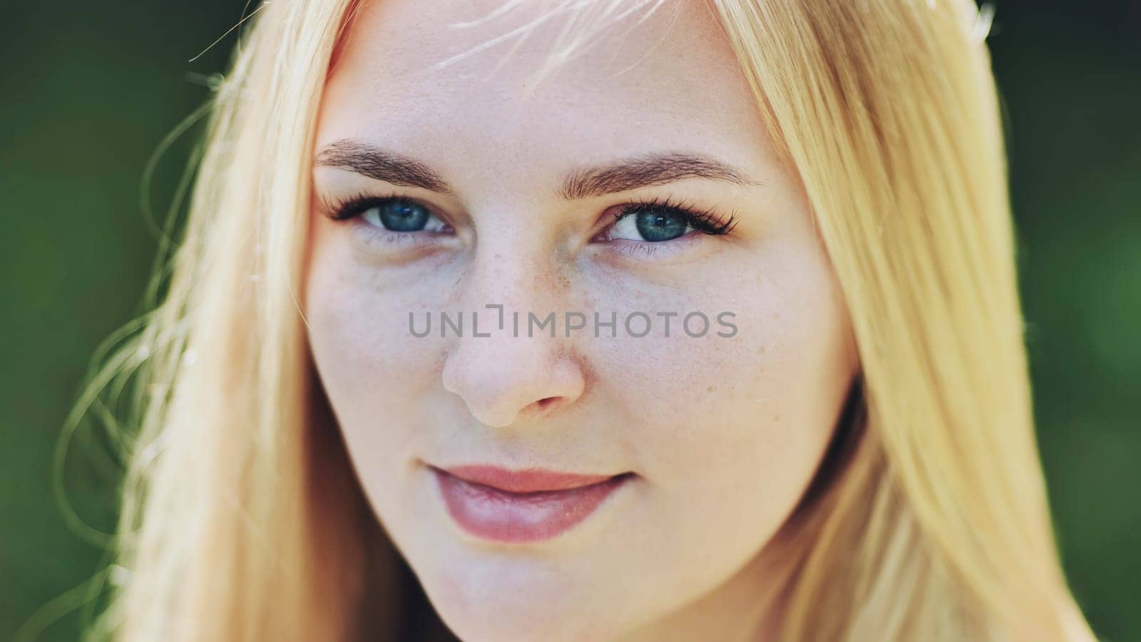 The face of a young Slavic girl blonde close-up