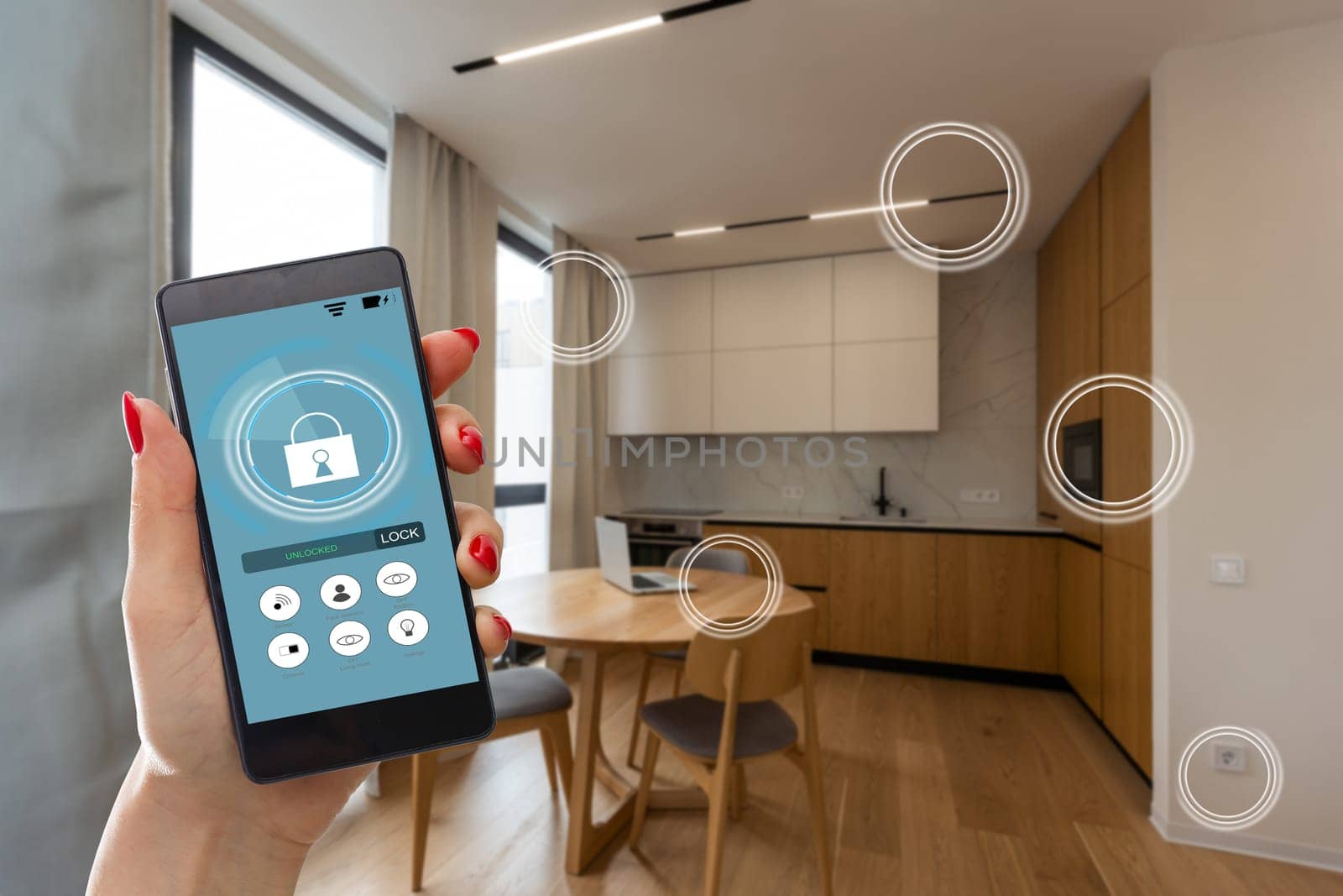 Home temperature, safety and environment control on mobile app. Smart phone in woman hand. Living room in background by Andelov13