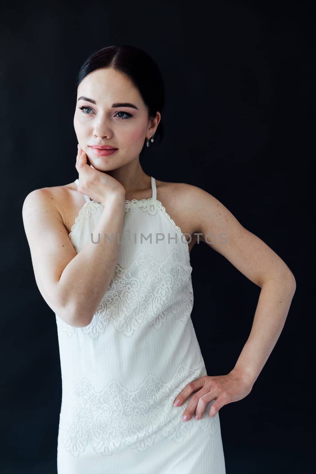 Portrait of beautiful slender fashionable young brunette woman