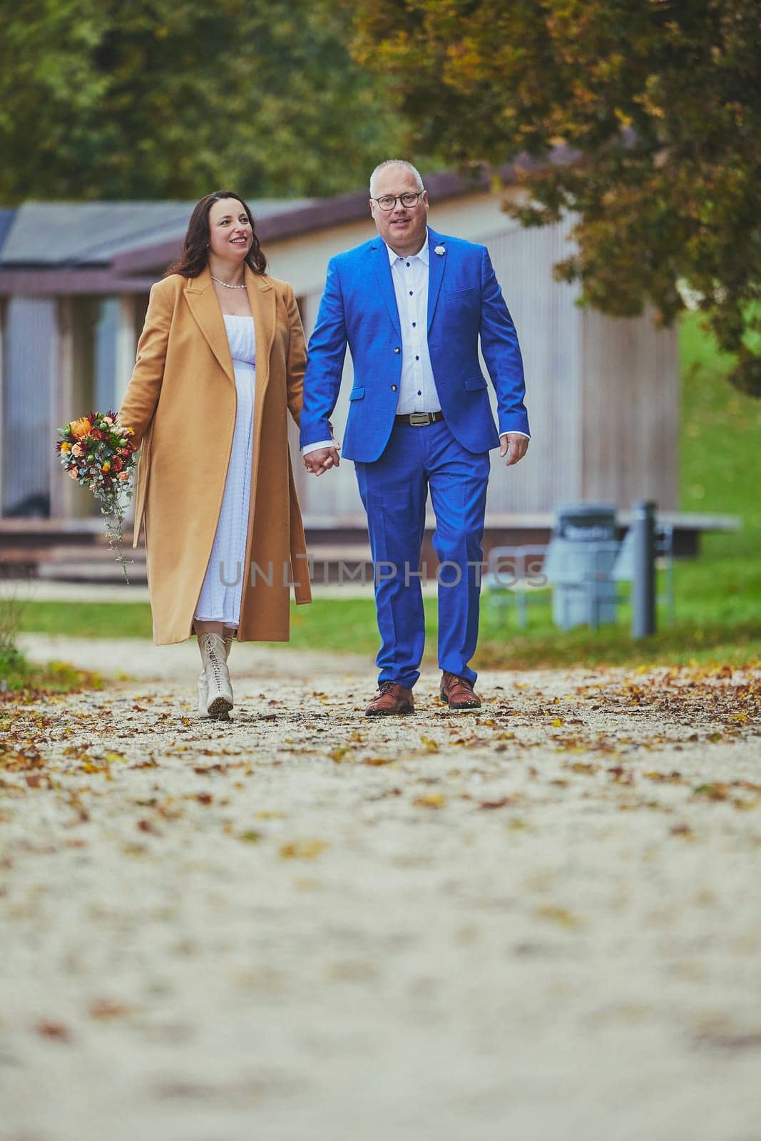 Vejle, Denmark, October 26, 2023: Couple in love walking in the park.