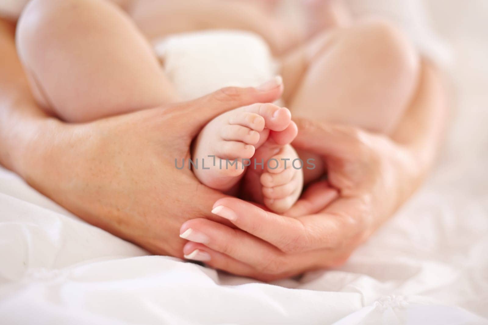 Woman, child and feet closeup for love connection or childhood bonding, motherhood or newborn. Female person, infant and toes or care support for kid growth development, parent trust or nurture youth by YuriArcurs