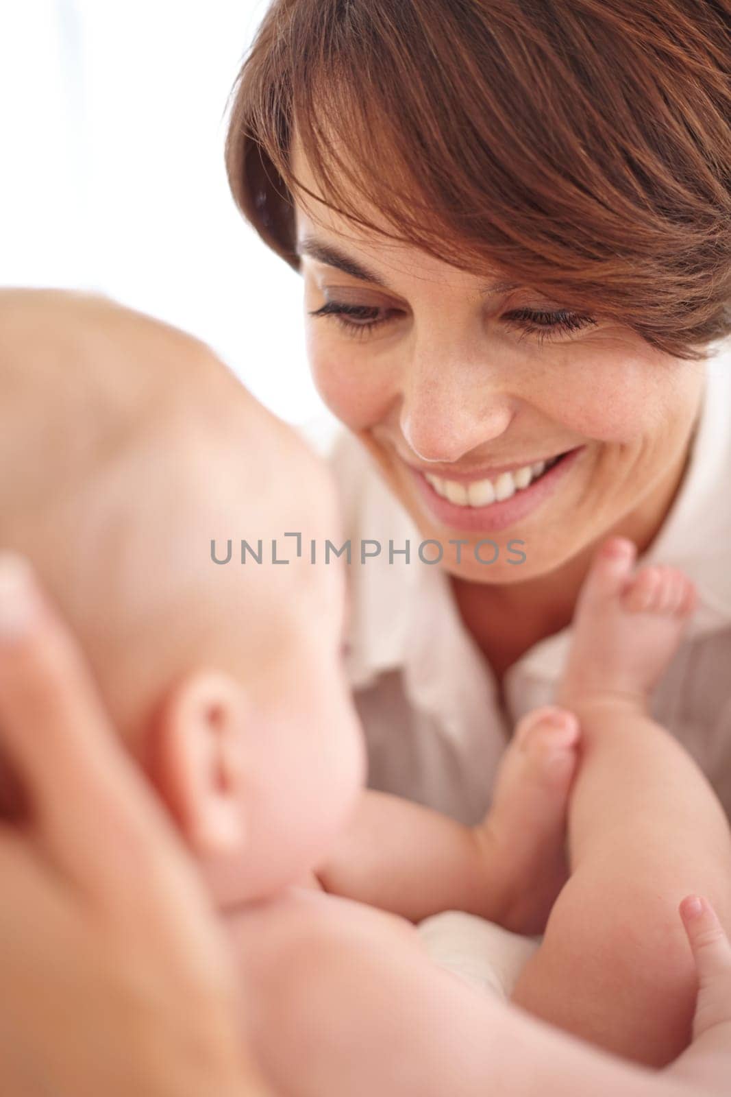 Mother, baby and happiness or love, smile and relaxing or care, bonding and joy in parenthood. Mom, newborn and peace or calm at home, positive and happy for child development, joy and fun together.