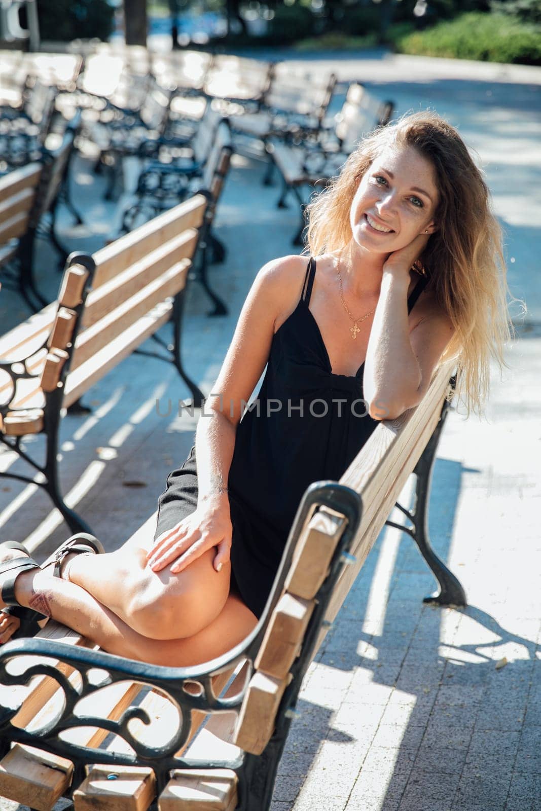 Beautiful woman in black summer dress