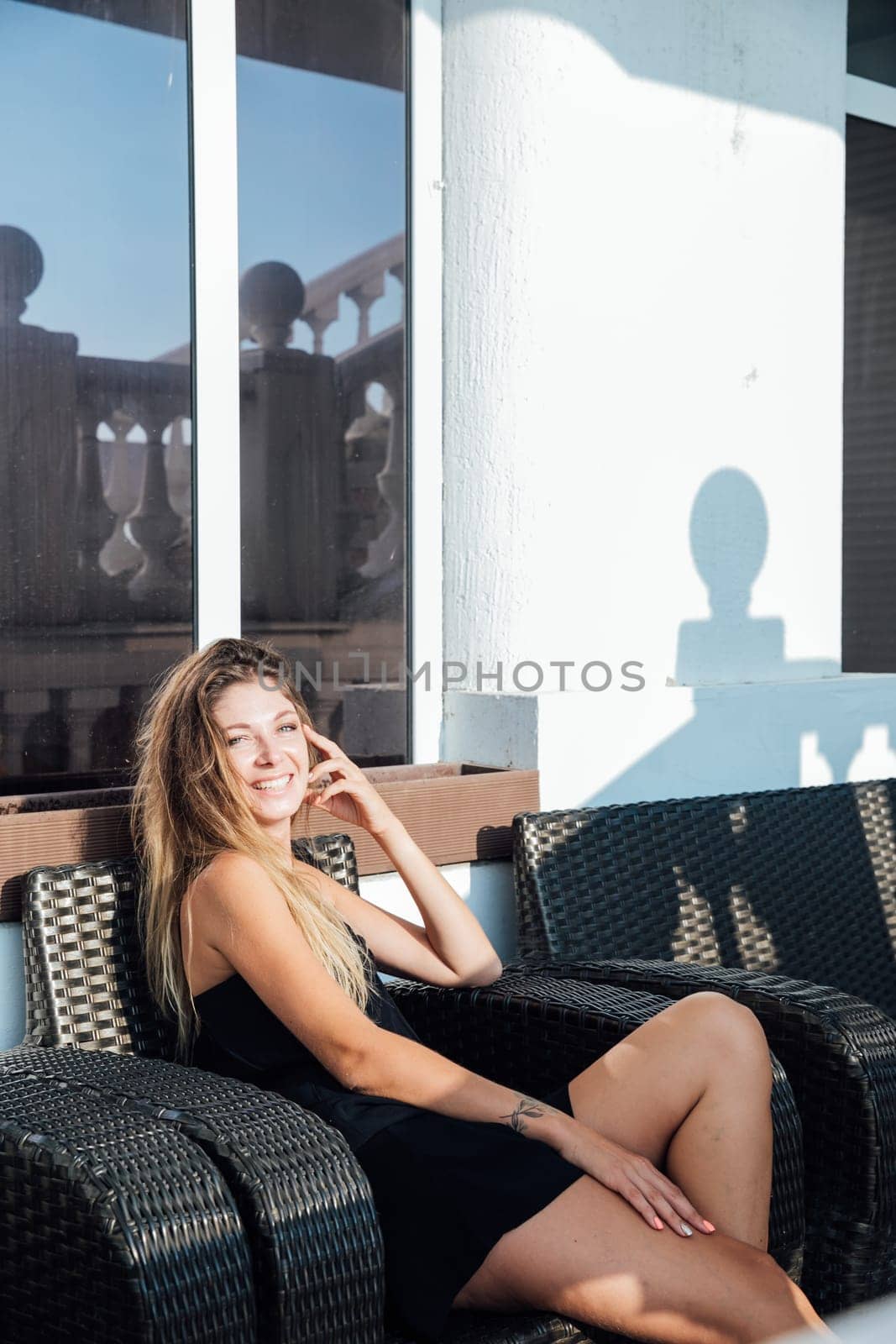 Beautiful slender woman in black summer dress by Simakov