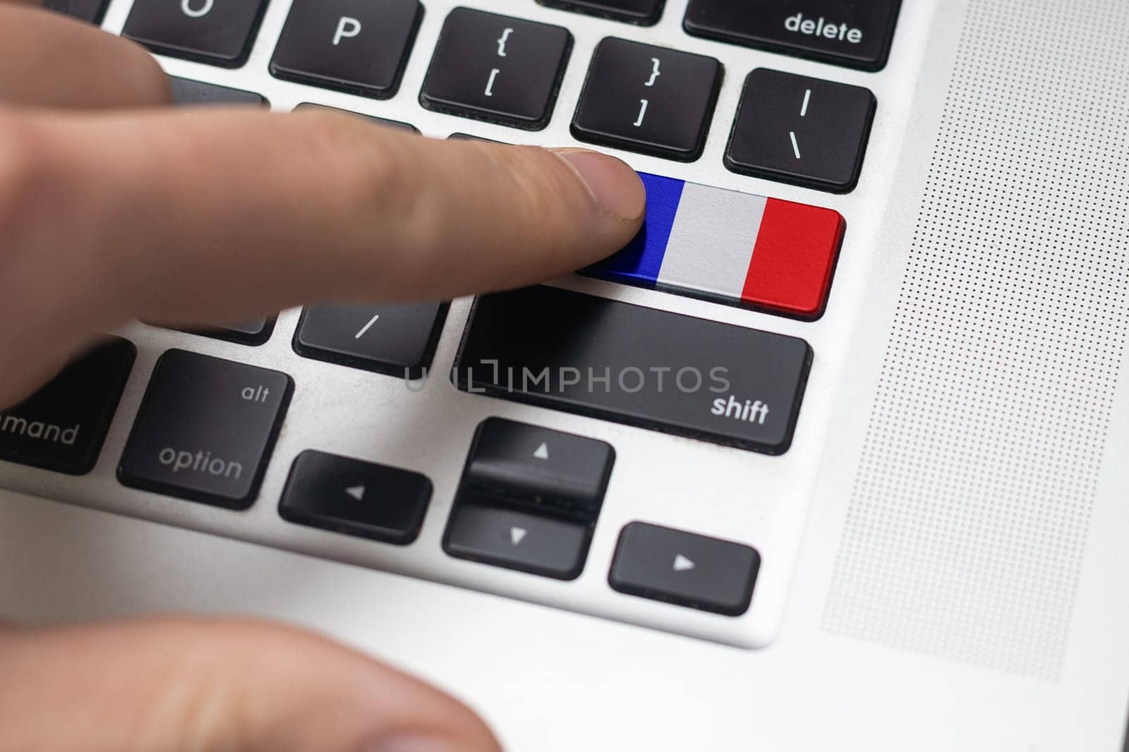 A keyboard with a labeled button - Flag of France.