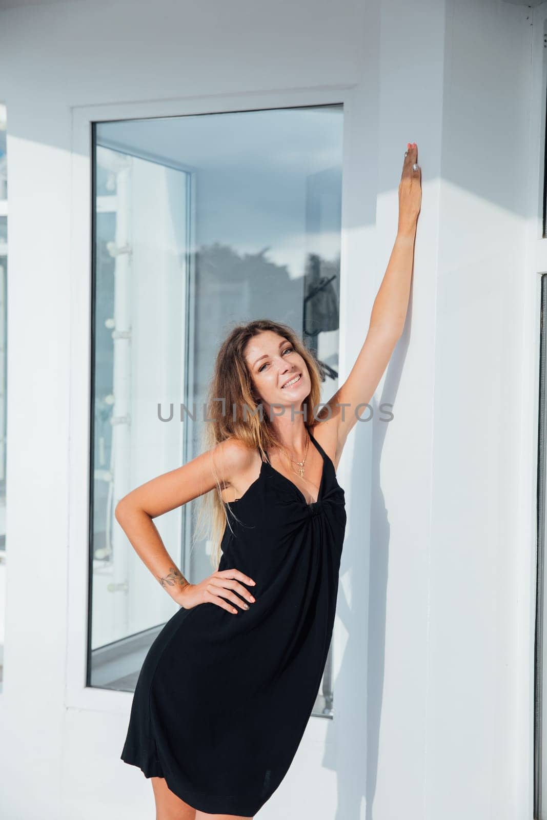 Beautiful woman in black summer dress