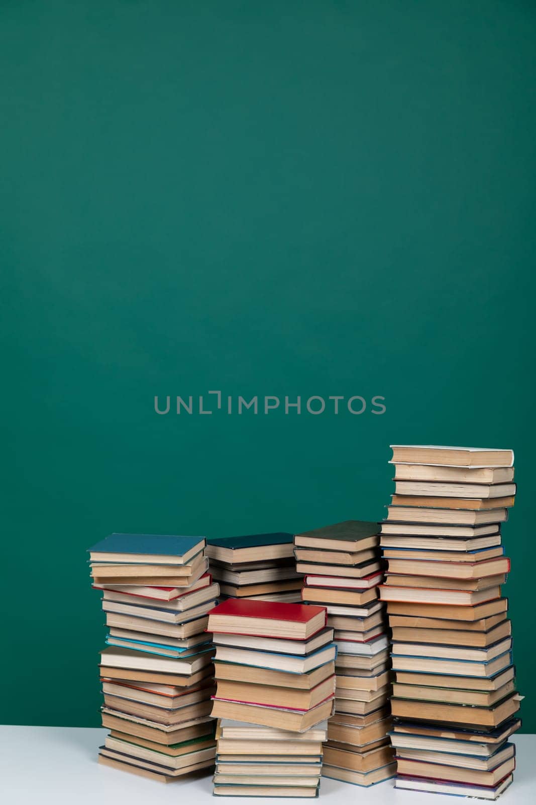 Stacks of Educational Books College Library Green Background