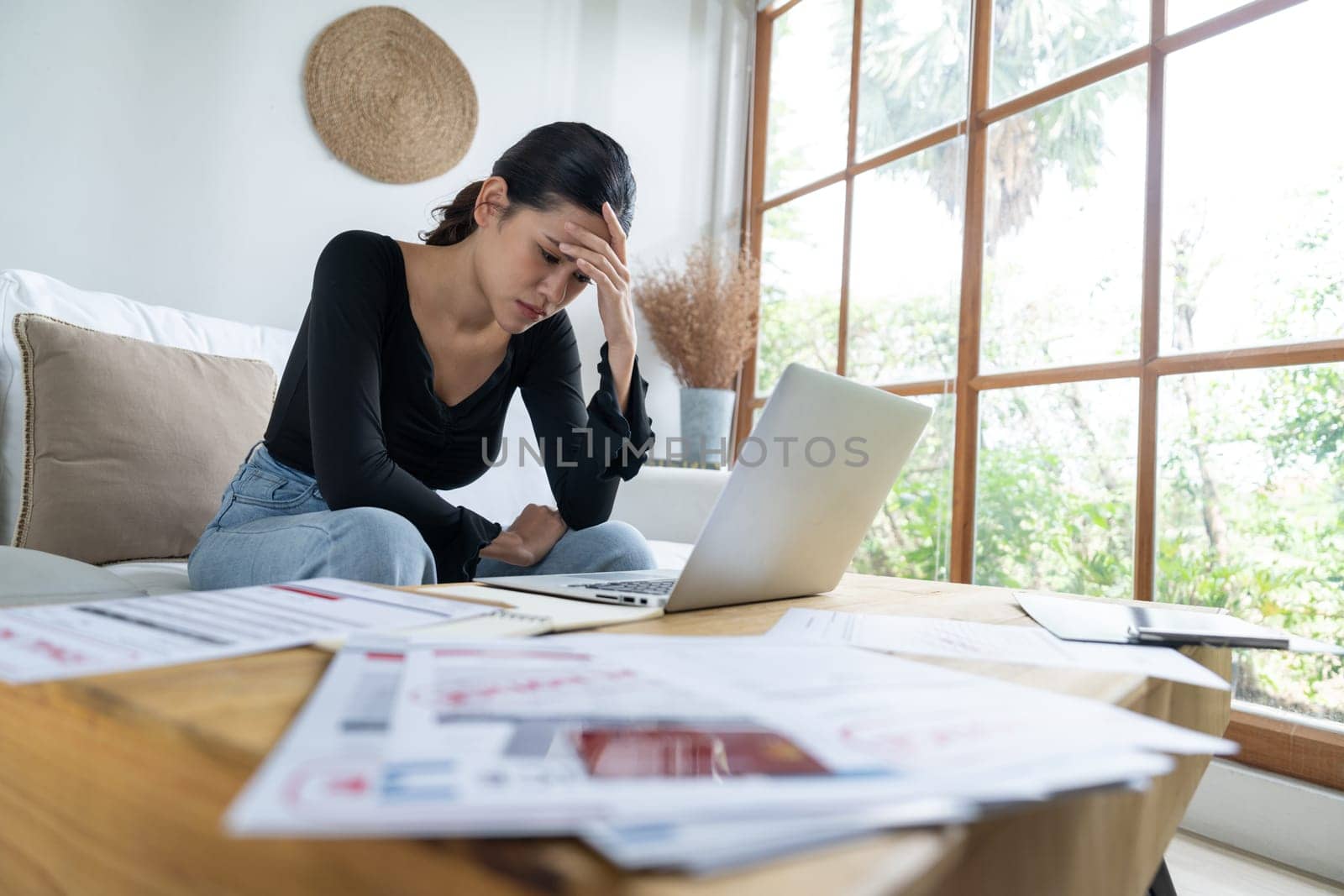 Stressed young woman has financial problems with credit card debt to pay uttermost show concept of bad personal money and mortgage pay management crisis.