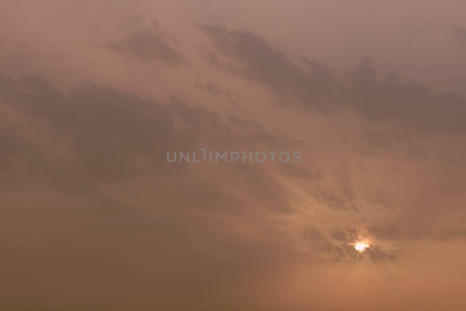 A sky, with diffused sun, clouds, colourful, by raul_ruiz
