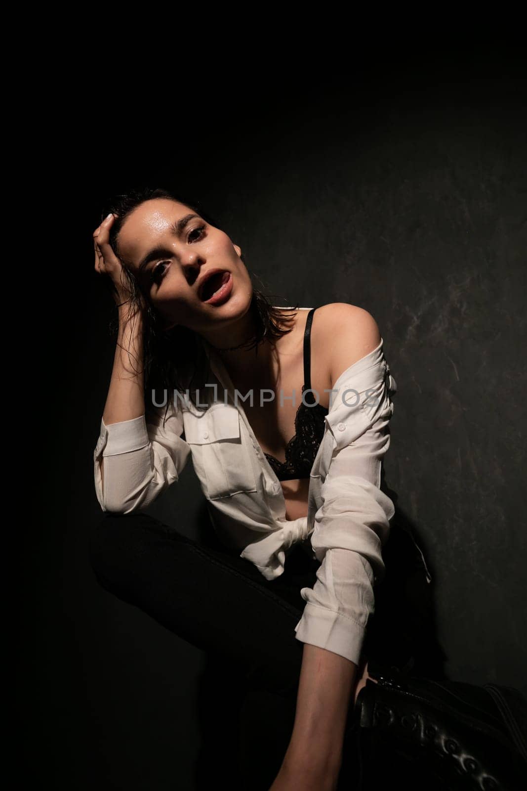 Woman posing in a dark room