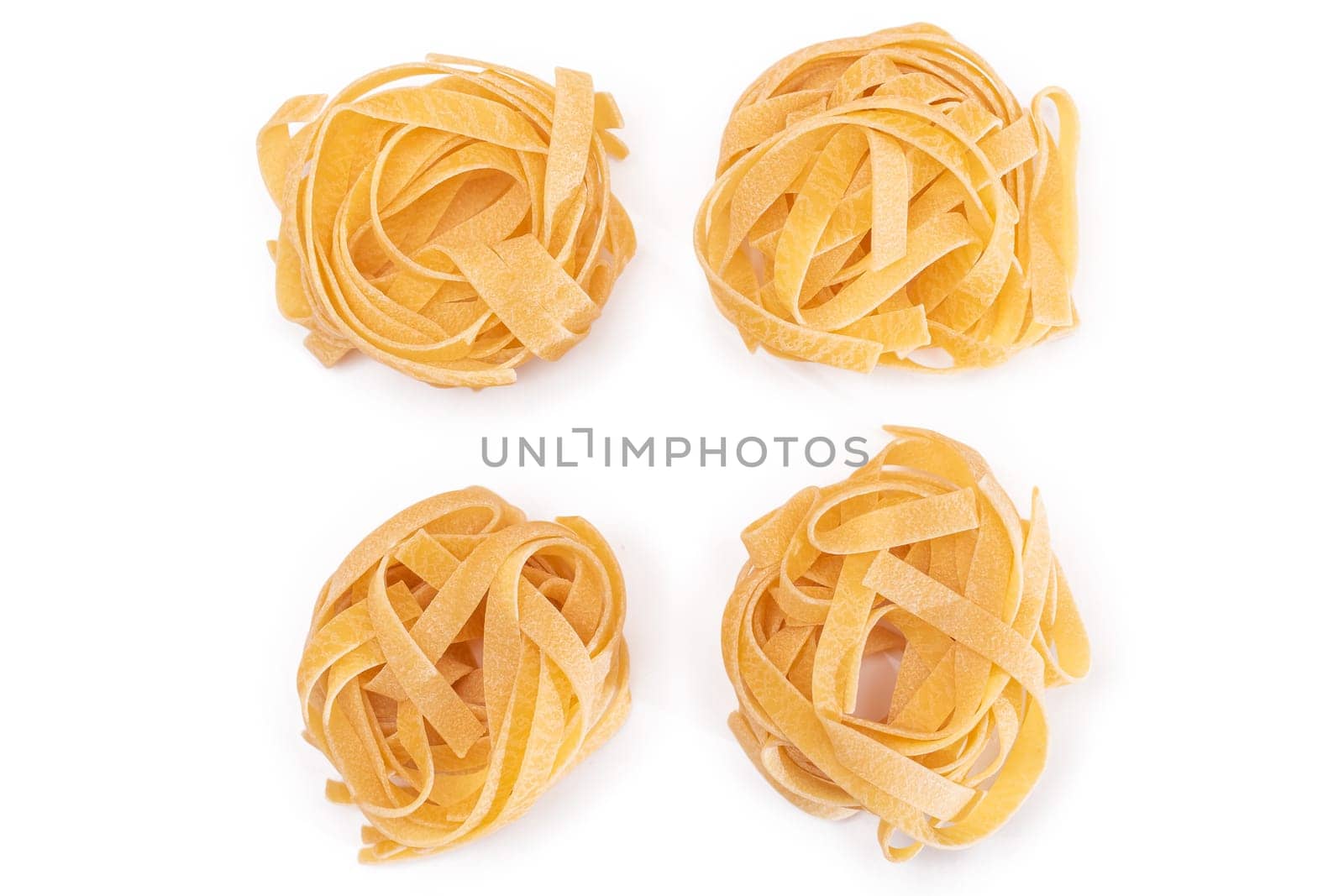 Four Classic Italian Raw Egg Fettuccine - Isolated on White Background by InfinitumProdux