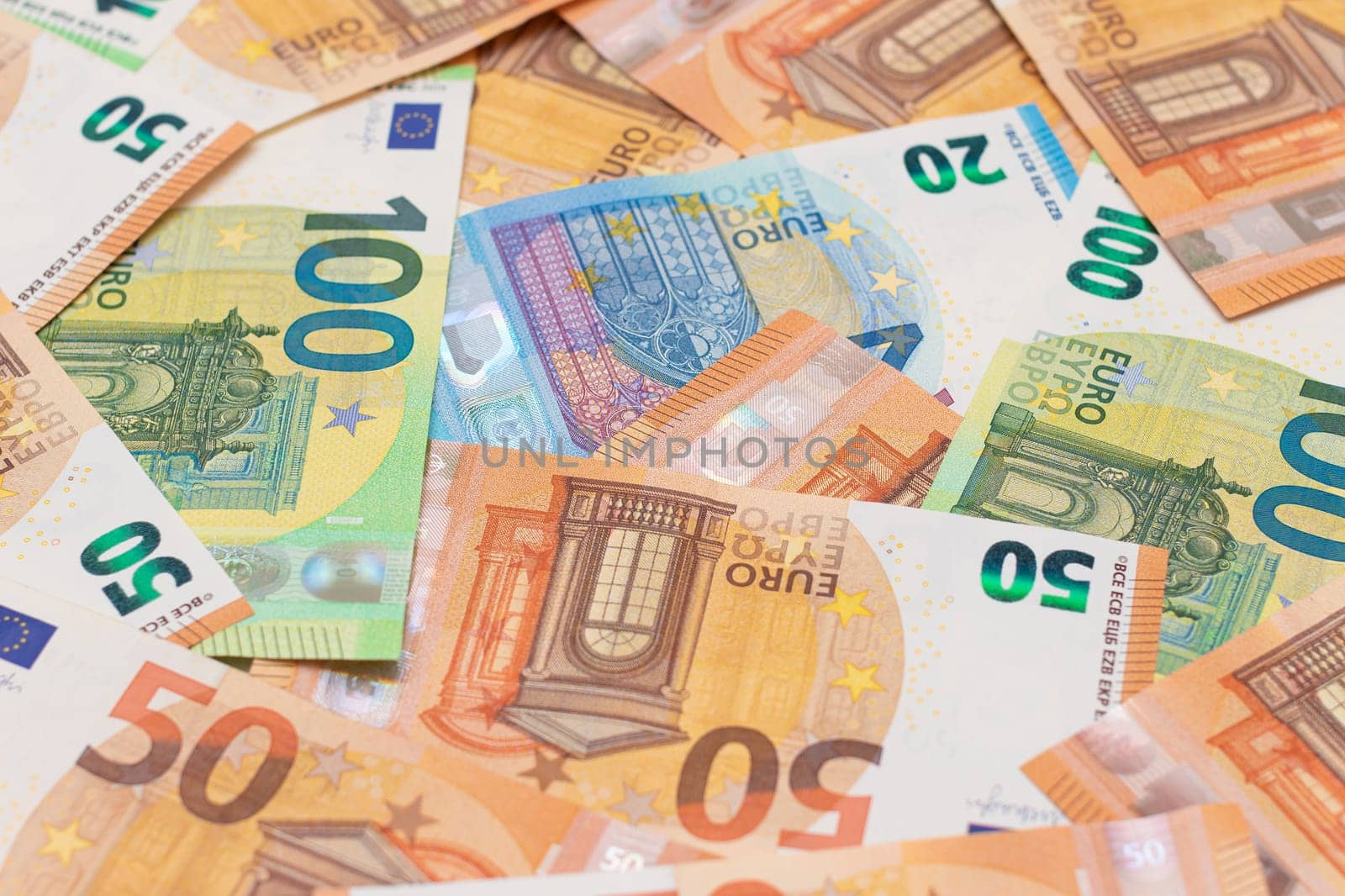 Different Euro Banknotes Money Background. Euro Money Currency. Colored Paper Money. A Lot of Fifty Euro Bills. Business, Finances, Cash and Money Saving Concept