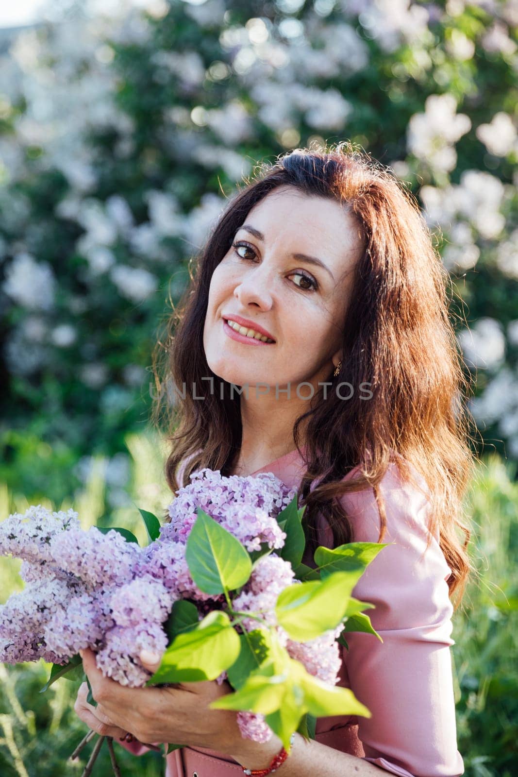 beautiful woman with gray on a walk nature flowers by Simakov