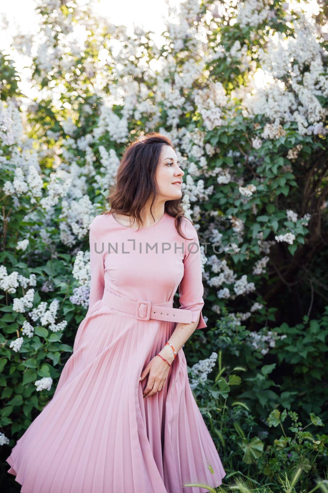 beautiful woman with gray on a walk flowers