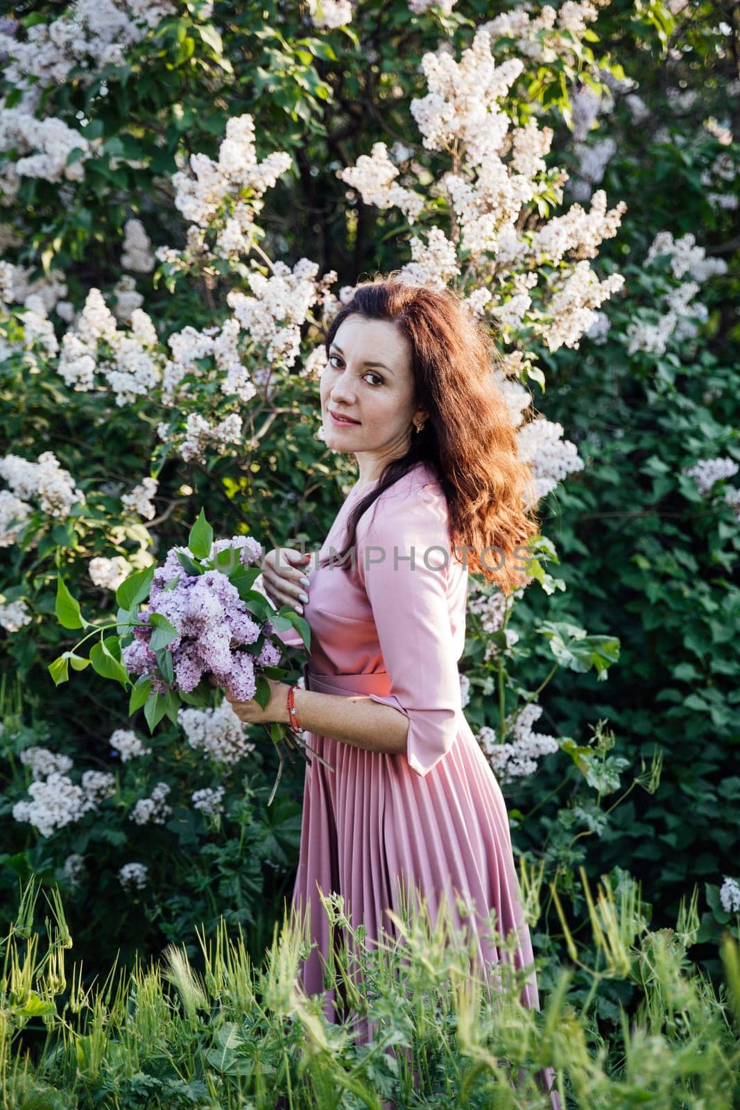 Flowers nature beautiful woman with gray on a walk by Simakov