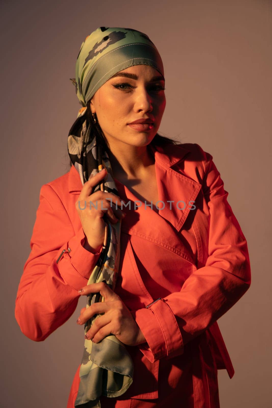 Fashionable woman in headscarf posing