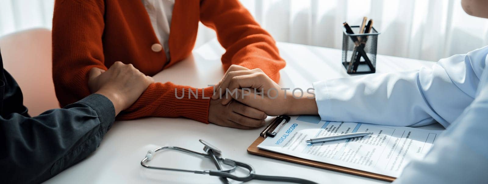 Couple attend fertility or medical consultation with gynecologist at hospital as family planning care for pregnancy while doctor and husband consoling young wife through appointment. Panorama Rigid