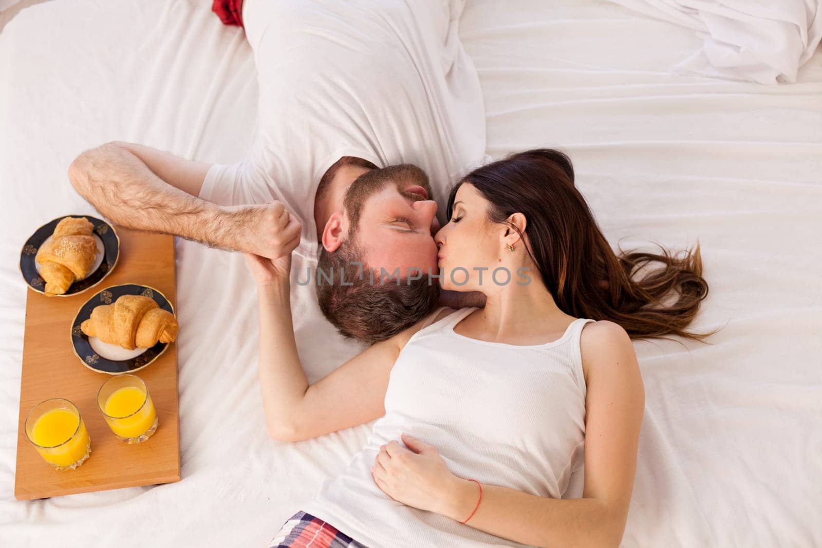 a man with a woman breakfast in bed in the morning 1