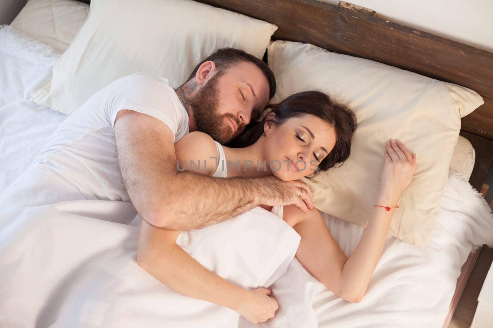 a man with a woman sleeping in beds bedroom 1