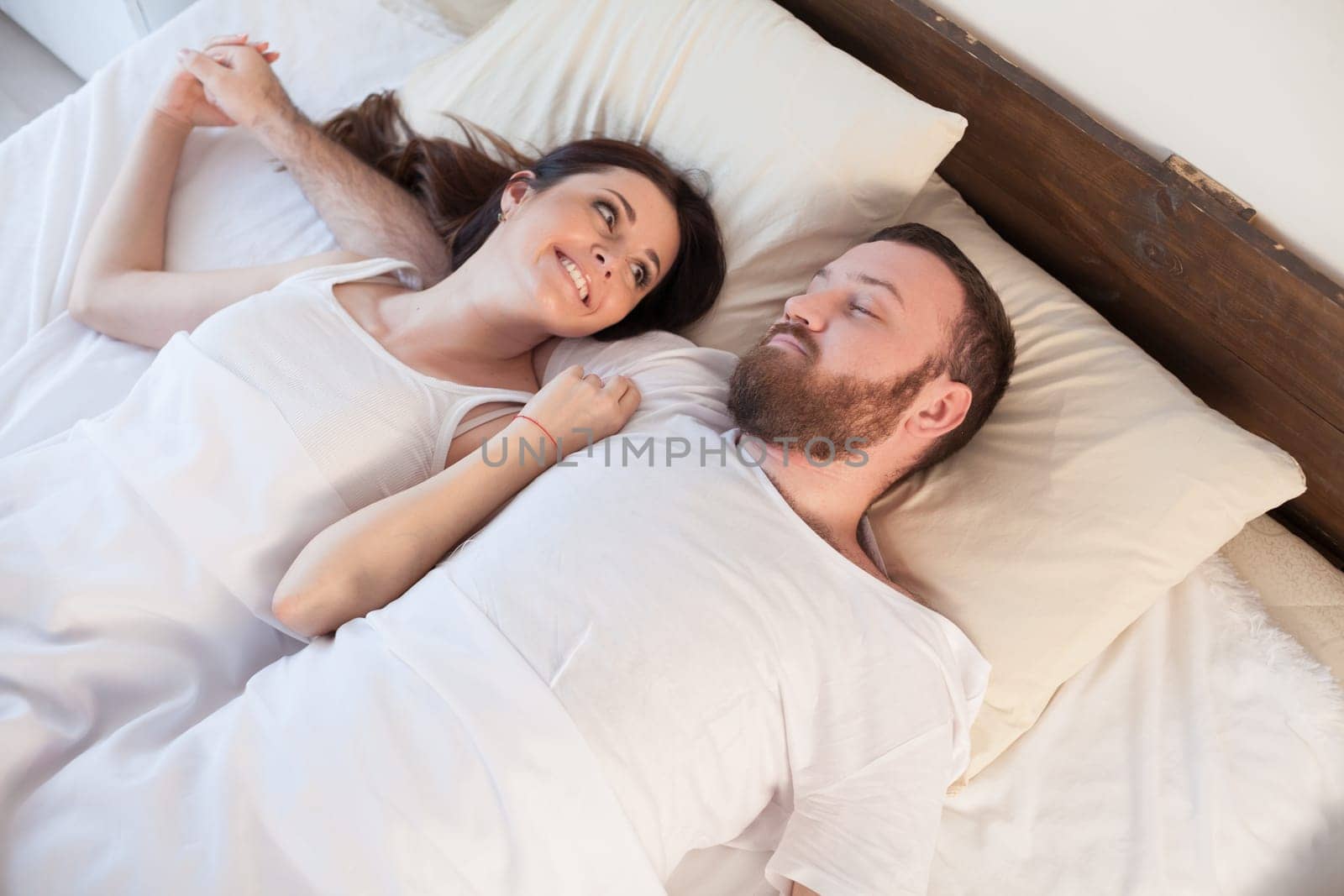 a man with a woman sleeping in beds bedroom 1