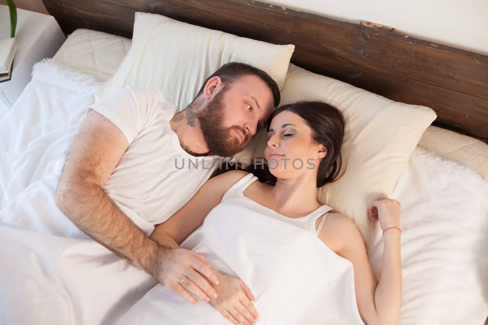 married couple sleeping in the bedroom 1 2