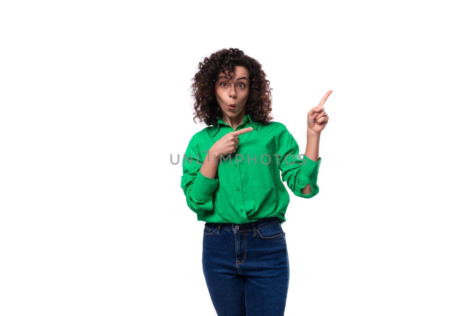 cute young woman with black curly hair dressed in a green shirt is inspired by the idea.