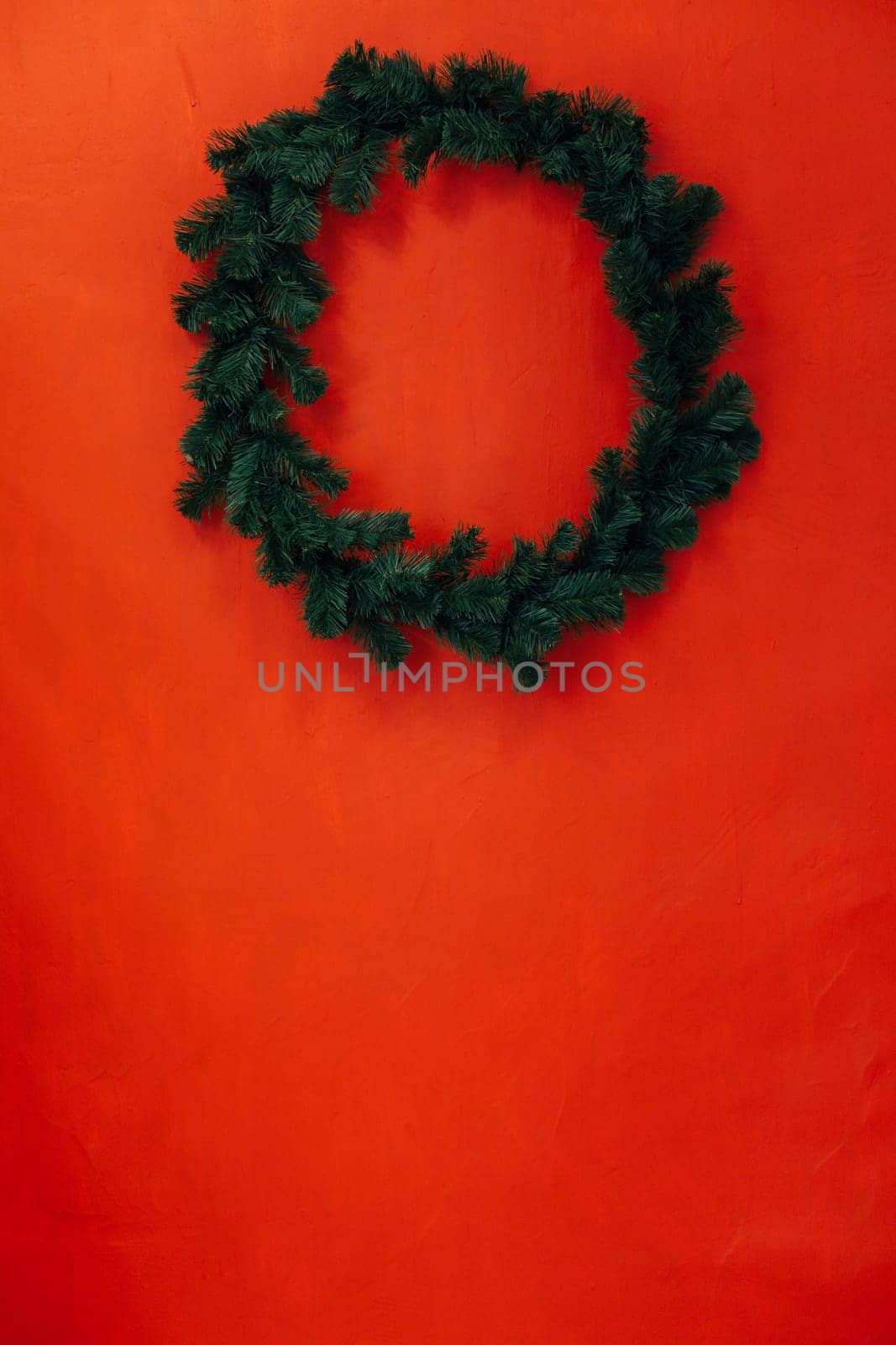 Christmas wreath for the new year in the interior of the rose wall