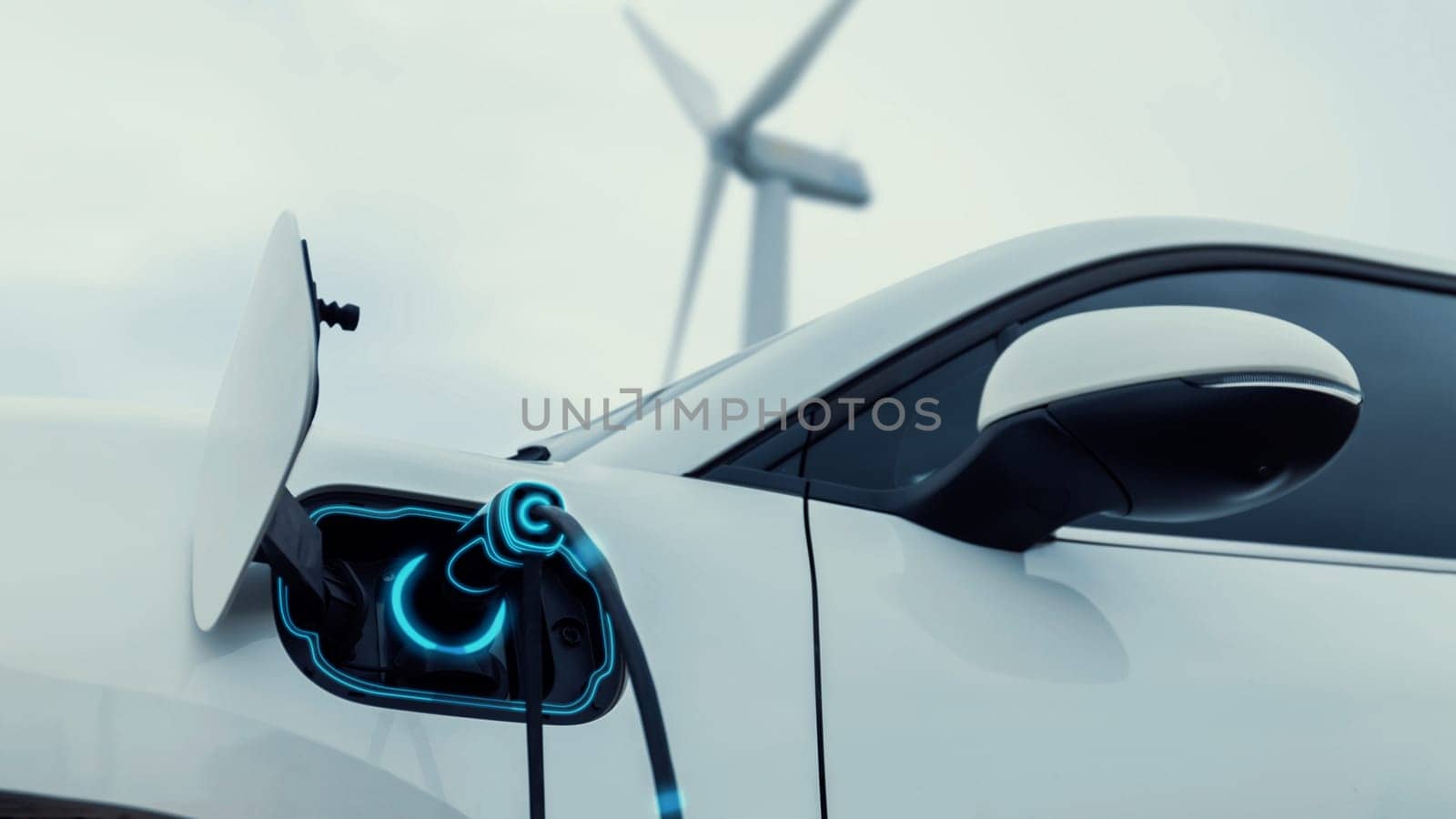 Electric car recharging energy from charging station in wind turbine farm.Peruse by biancoblue
