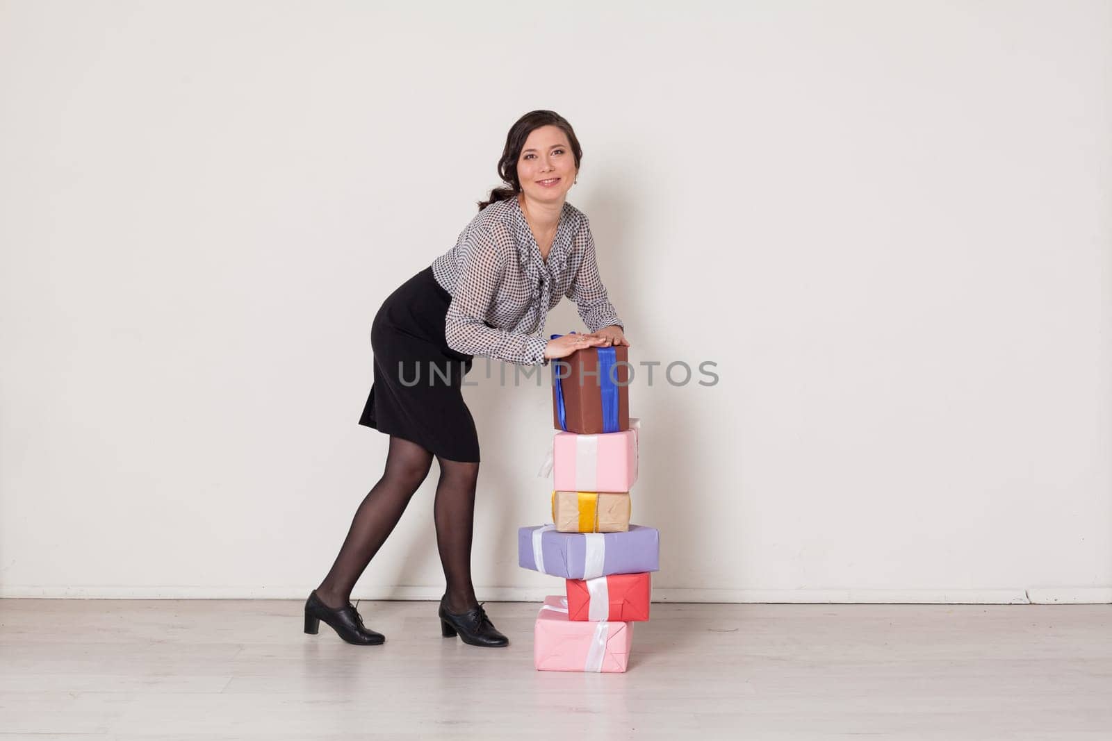 beautiful Asian woman with gifts at the holiday by Simakov