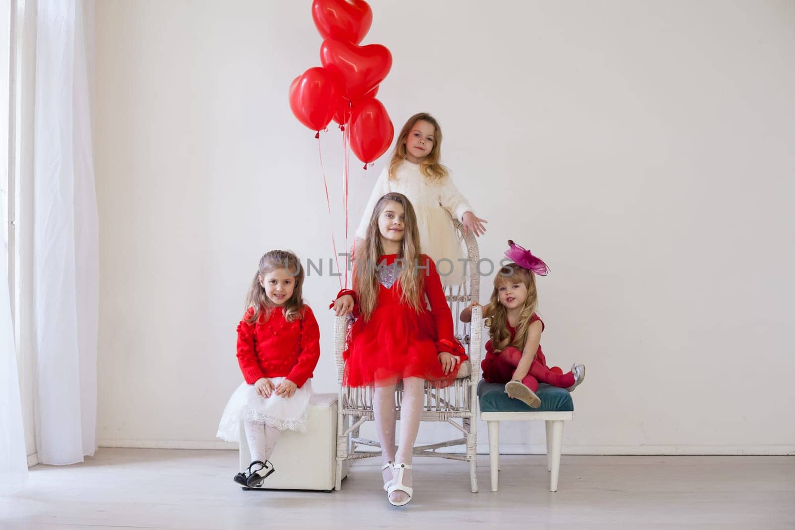 girls in red and white clothes on birthday party by Simakov