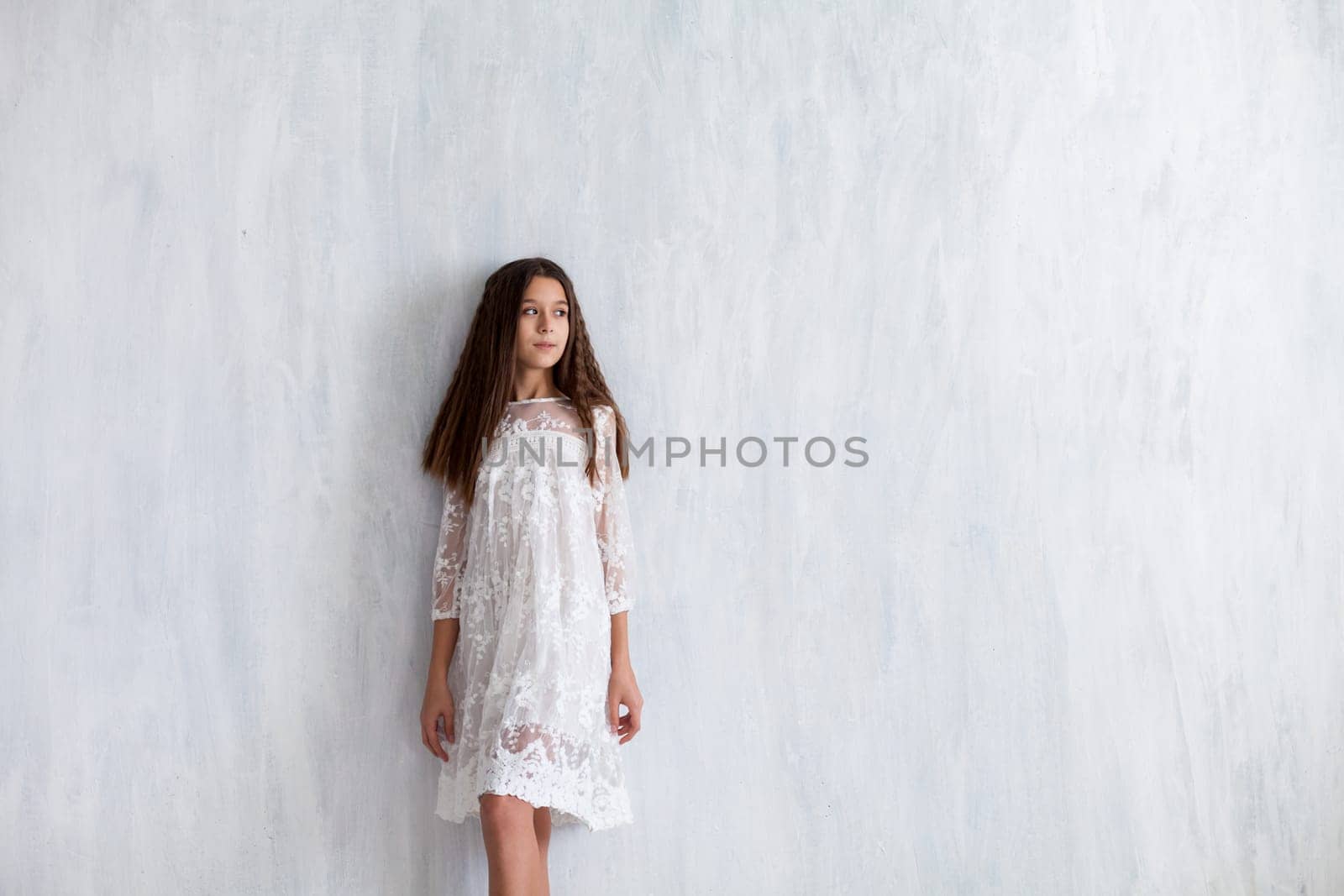 portrait of a beautiful fashionable girl in white clothes by Simakov