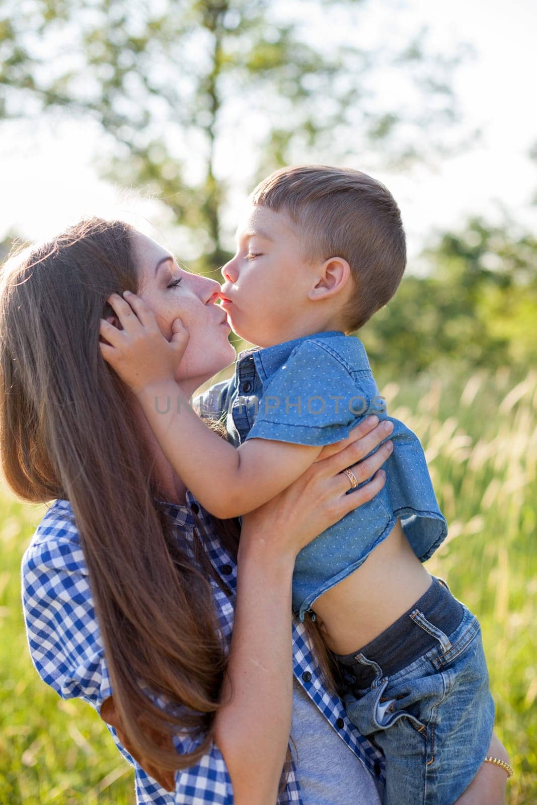 Portrait of a woman with her son on a walk in nature