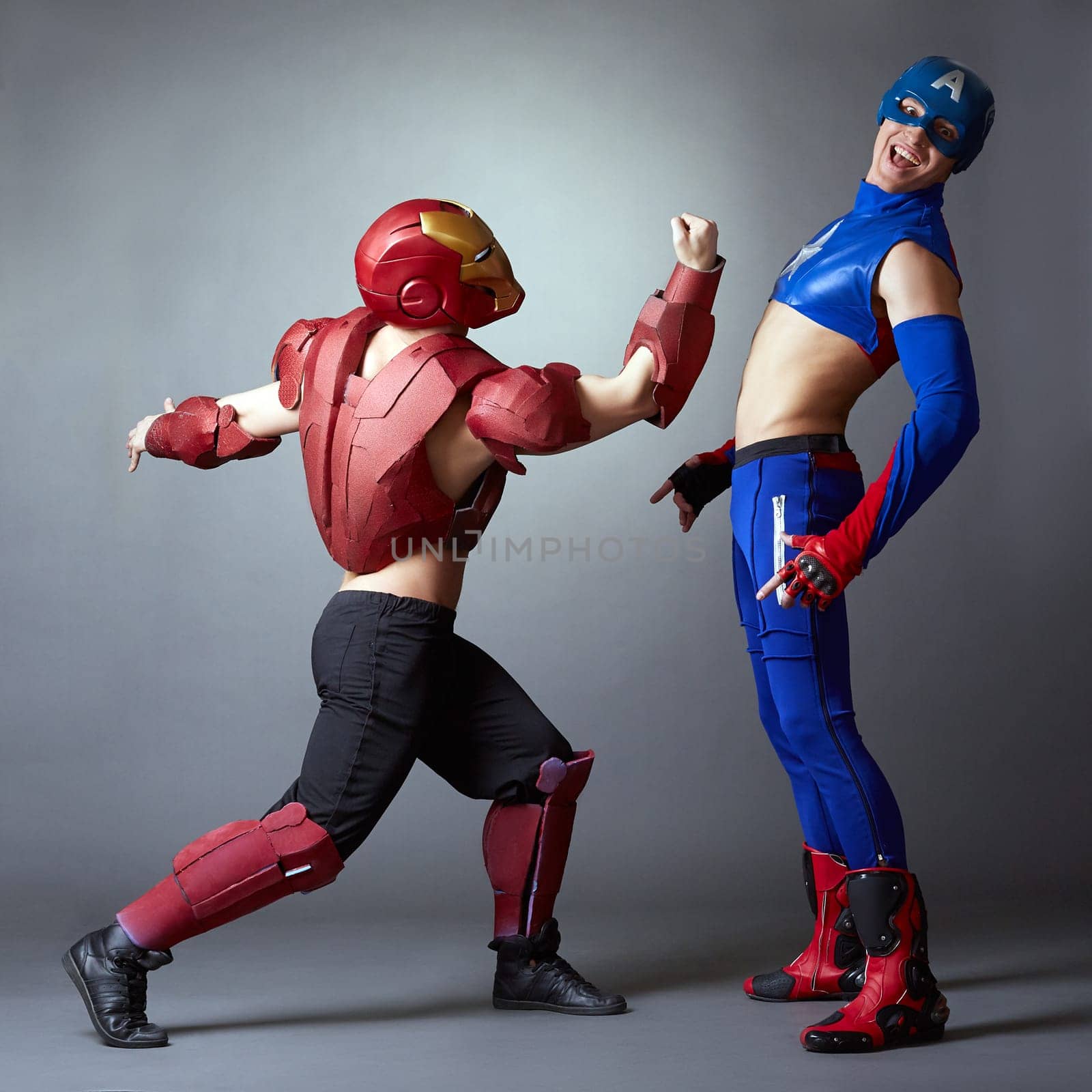 Confrontation of superheroes. Sexy male dancers by rivertime