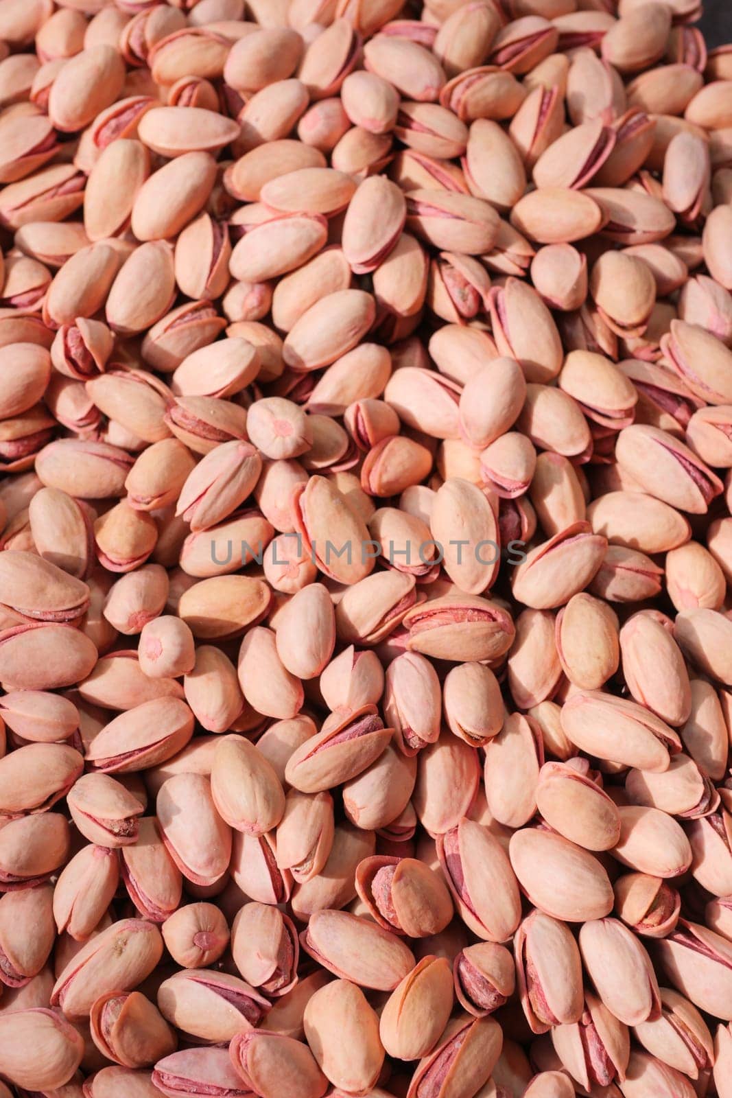 detail shot of pistachios nut on in bowl .