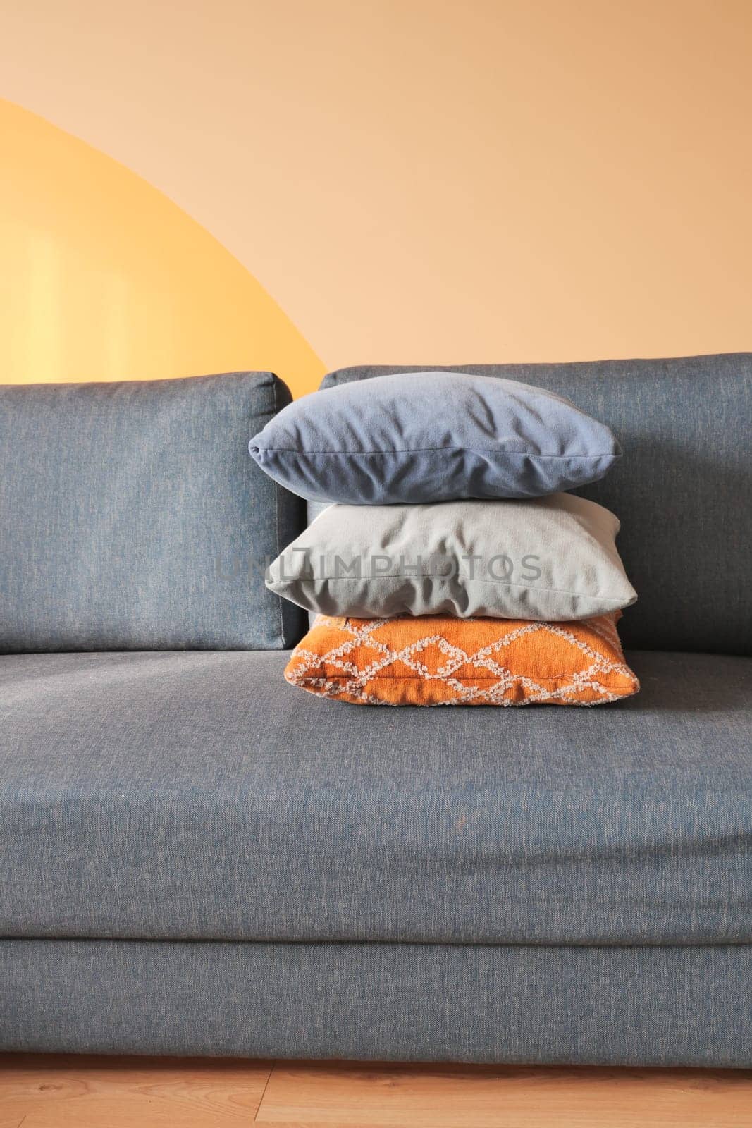 modern sofa with pillows in living room at home.