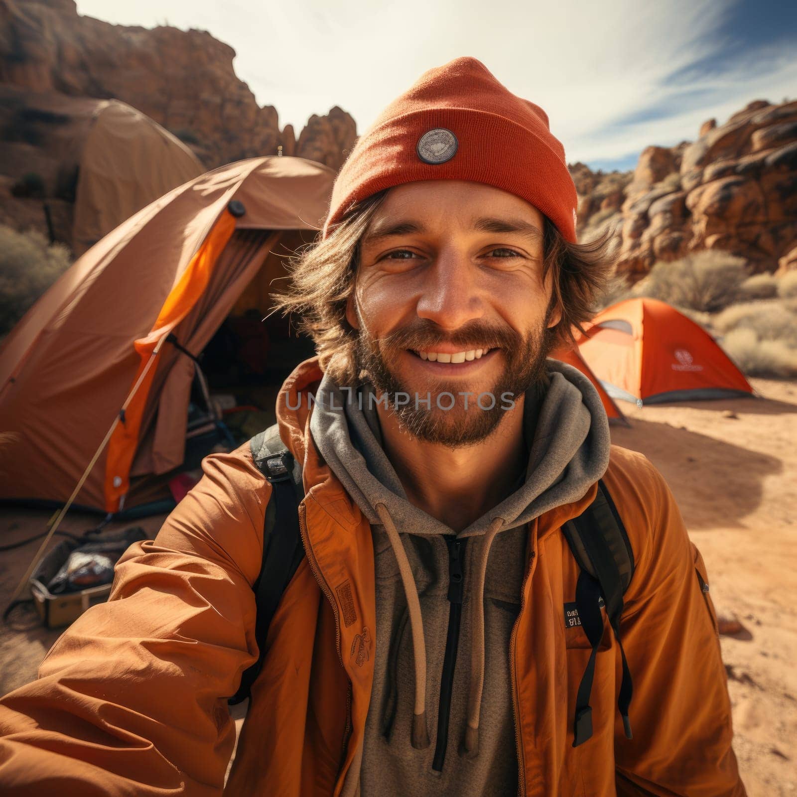 Happy hiker man with hat making selfie photo portrait background tent mountain. Concept travel blogger, adventure life trip. AI Generated