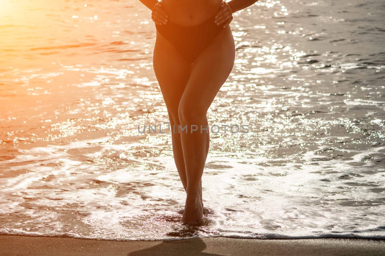 Woman summer travel sea. Happy woman enjoying her summer travels, captured in a lower body portrait, taking photos to preserve her memories of the scenic sea beach sharing travel adventure journey by panophotograph