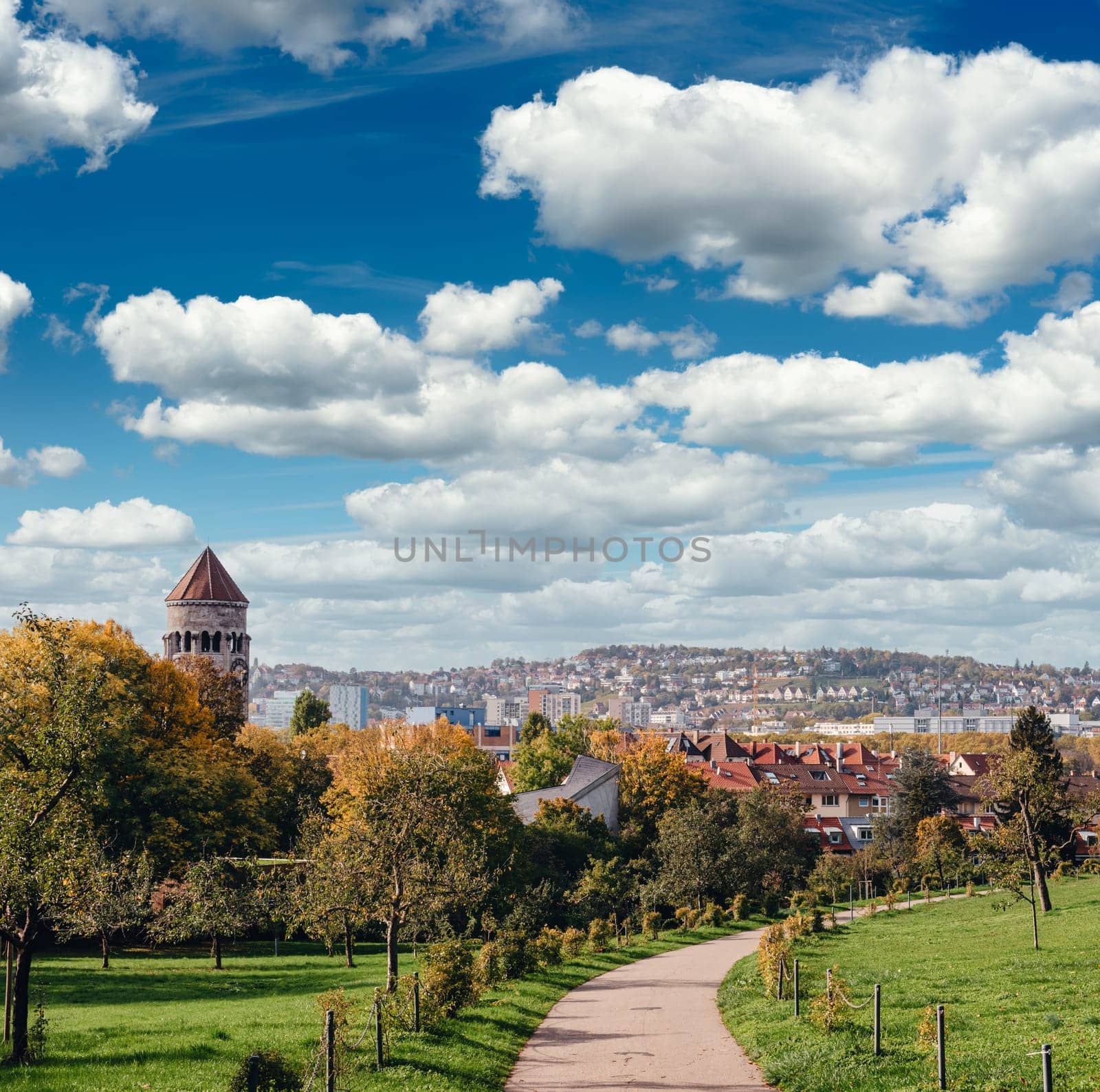 Germany, Stuttgart panorama view. Beautiful houses in autumn, Sky and nature landscape. Vineyards in Stuttgart - colorful wine growing region in the south of Germany with view over Neckar Valley. Germany, Stuttgart city panorama view above vineyards, industry, houses, streets, stadium and highway at sunset in warm orange light.