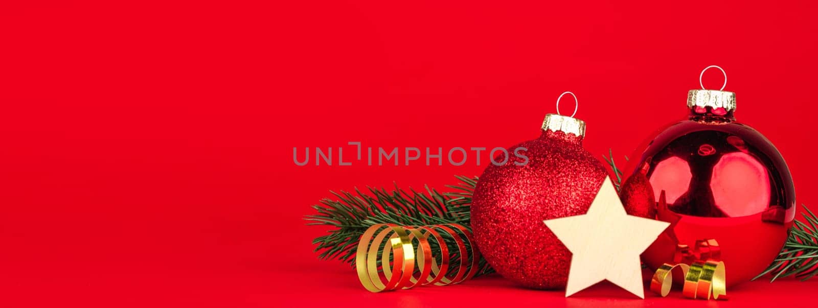 red christmas balls and star on bokeh background
