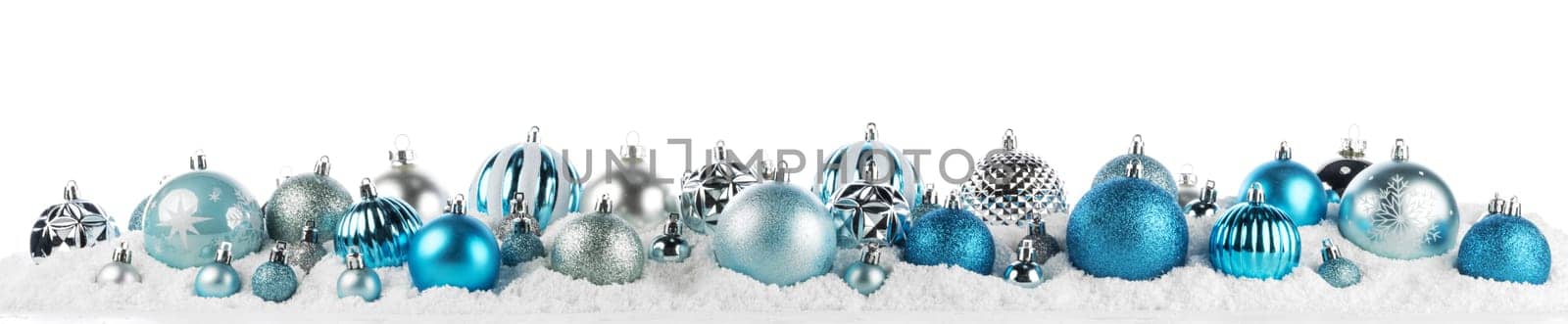 blue and silver christmas balls long frame on snow background