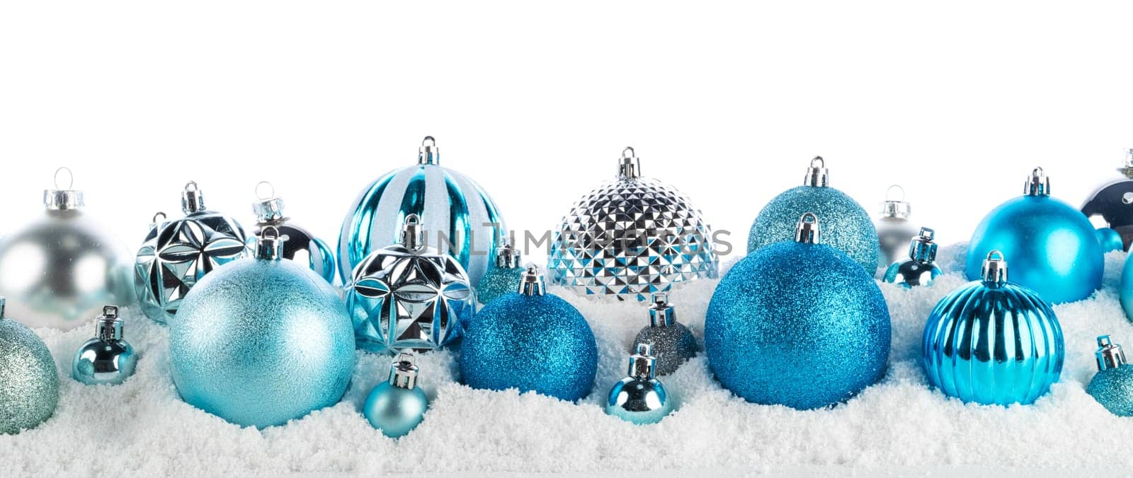 blue and silver christmas balls long frame on snow background