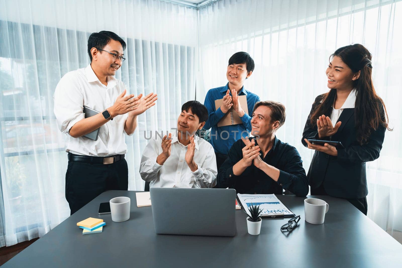 Excited and happy office worker employee celebrate after make successful strategic business marketing planning. Teamwork and positive attitude create productive and supportive workplace. Prudent