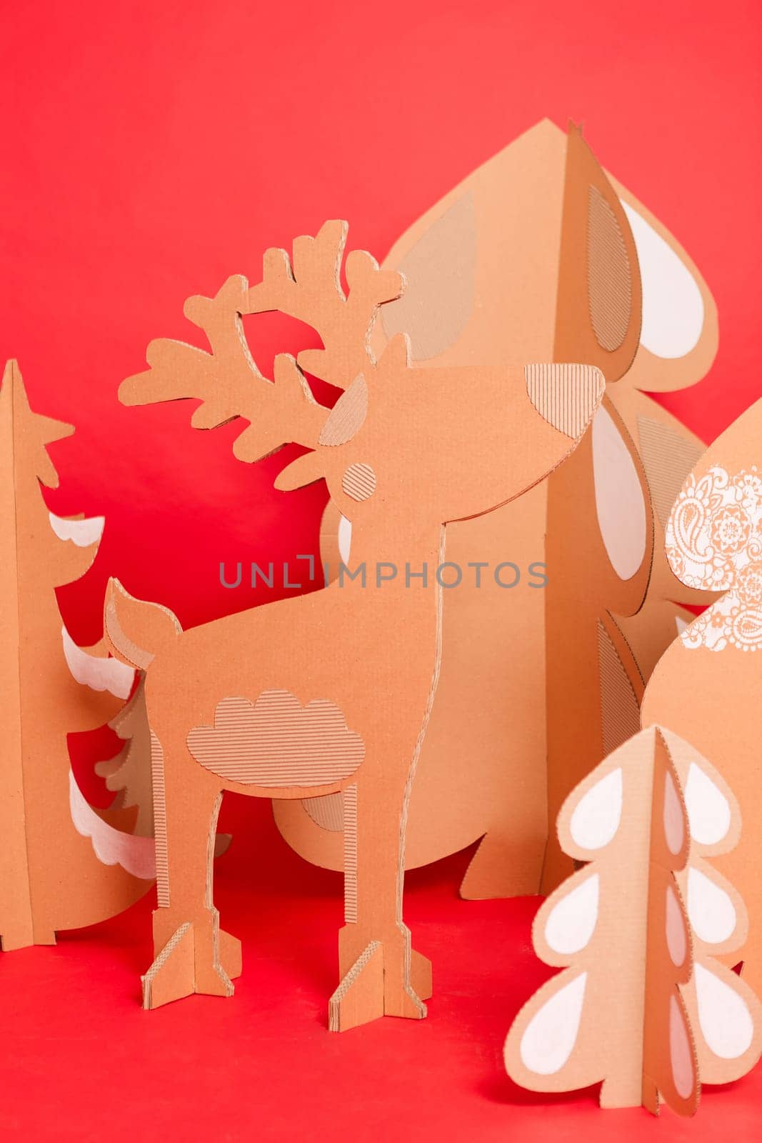 Deer from recycling cardboard. Space for text by sarymsakov