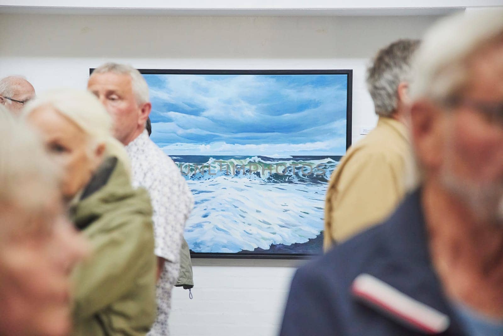 Skagen, Denmark, May 21,2023:Visitors look at the paintings in gallery by Viktor_Osypenko