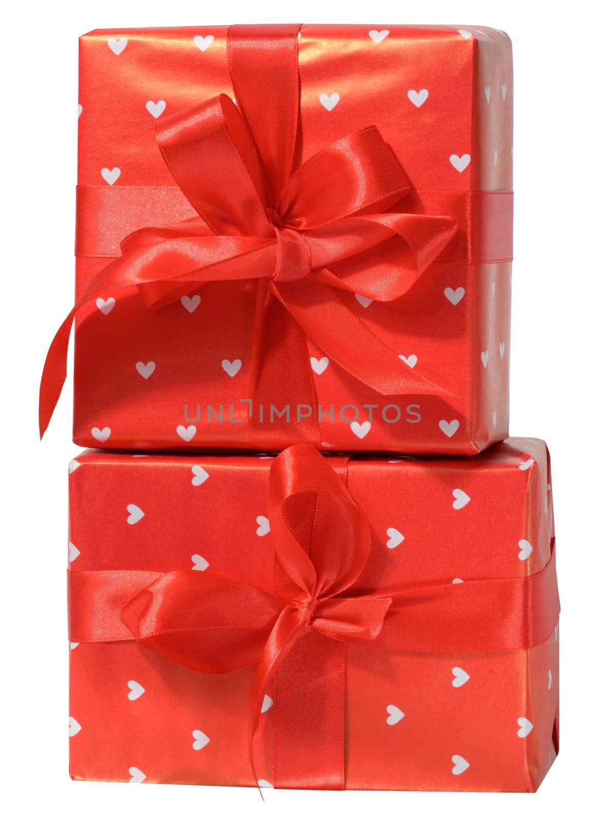 Box is wrapped in red gift wrapping and red ribbon on a white isolated background
