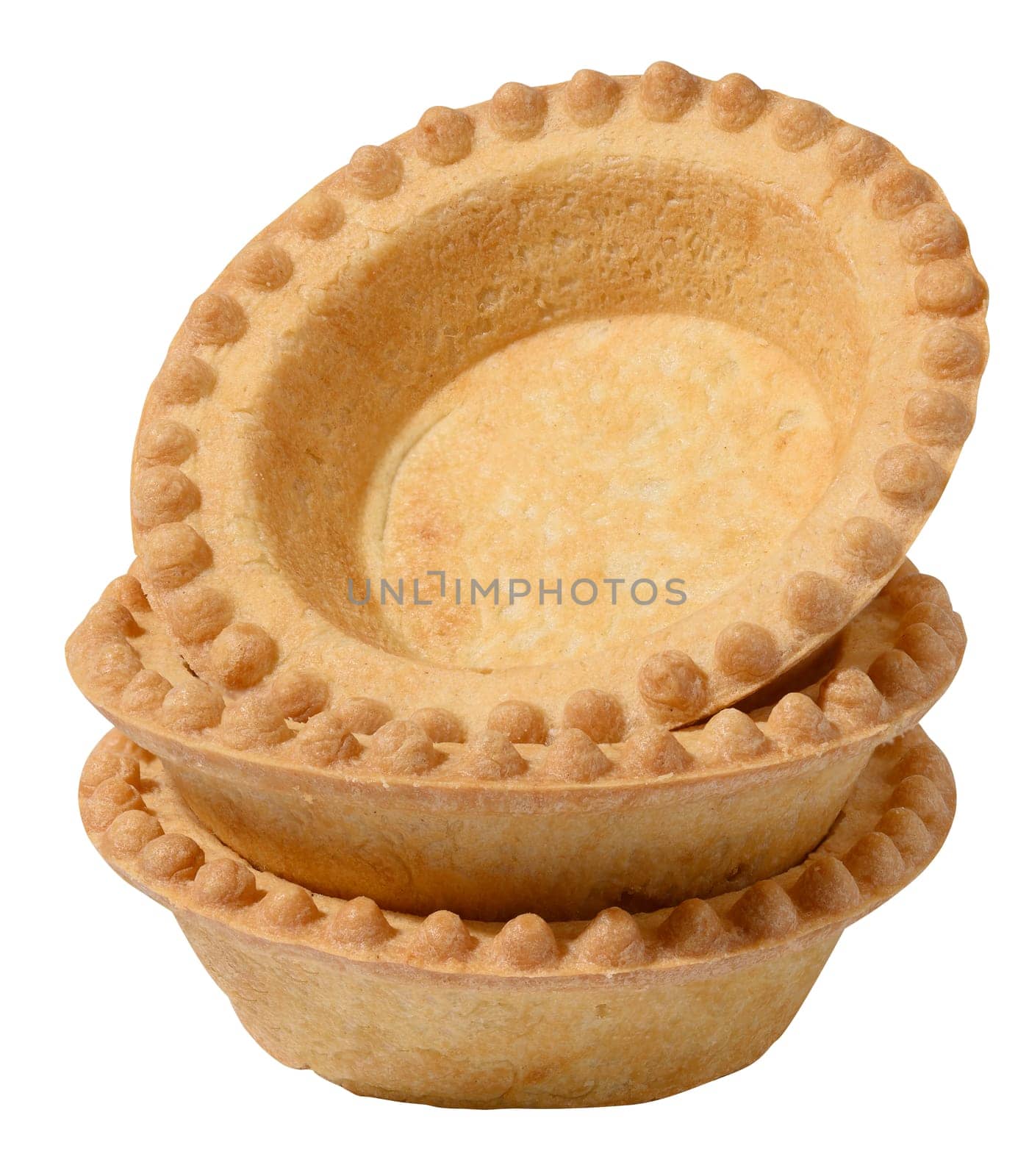 Stack of empty baked round canape baskets isolated on white background, close up