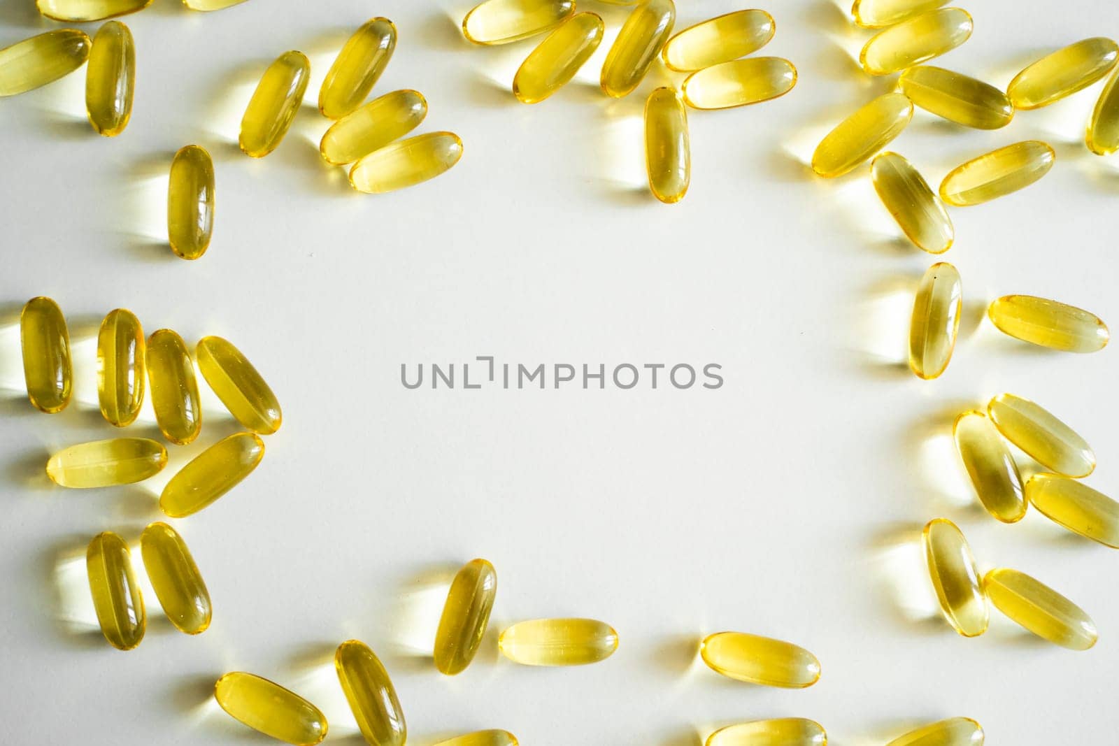 Close up of capsules Omega 3. Health care concept. Medical pill or vitamin's capsule pattern. Medicine, healthcare or pharmacy concept. by vovsht