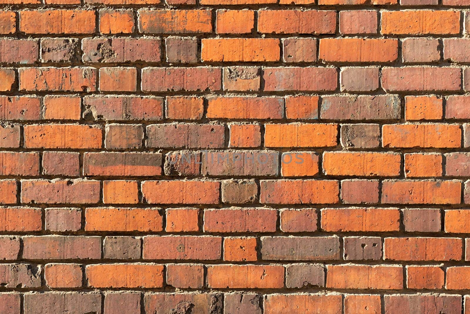 Background of red brick wall in the old town.