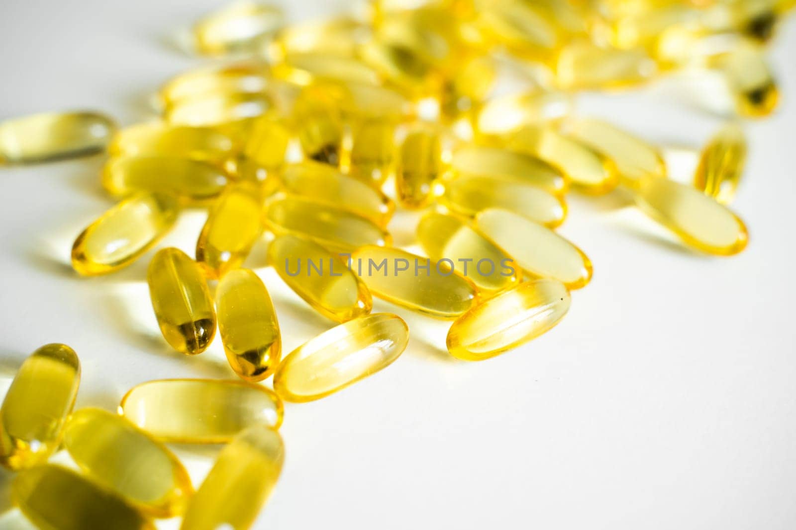 Cod liver oil omega 3 gel capsules. Fish oil capsules. Copy space for your text. Medical pill or vitamin's capsule pattern. Medicine, healthcare or pharmacy concept. by vovsht